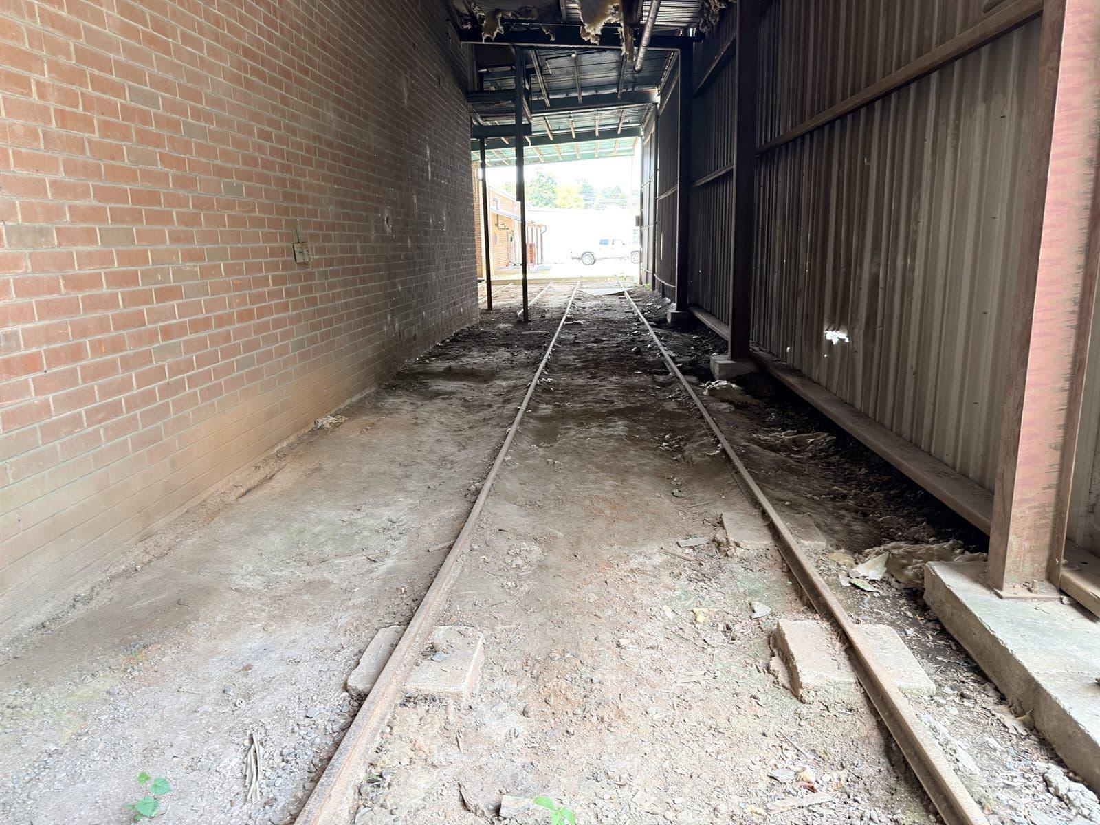 Rail siding running through a disused municipal warehouse on a pilot survey site